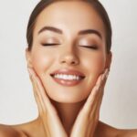 Close-up of the Forma handpiece (electrode) being used to deliver controlled heat for collagen stimulation on facial skin.